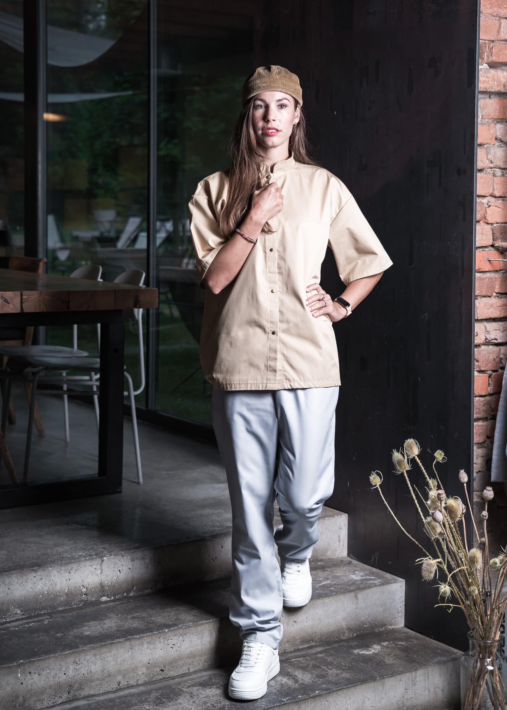 Sand shirt-style chef top and light trousers