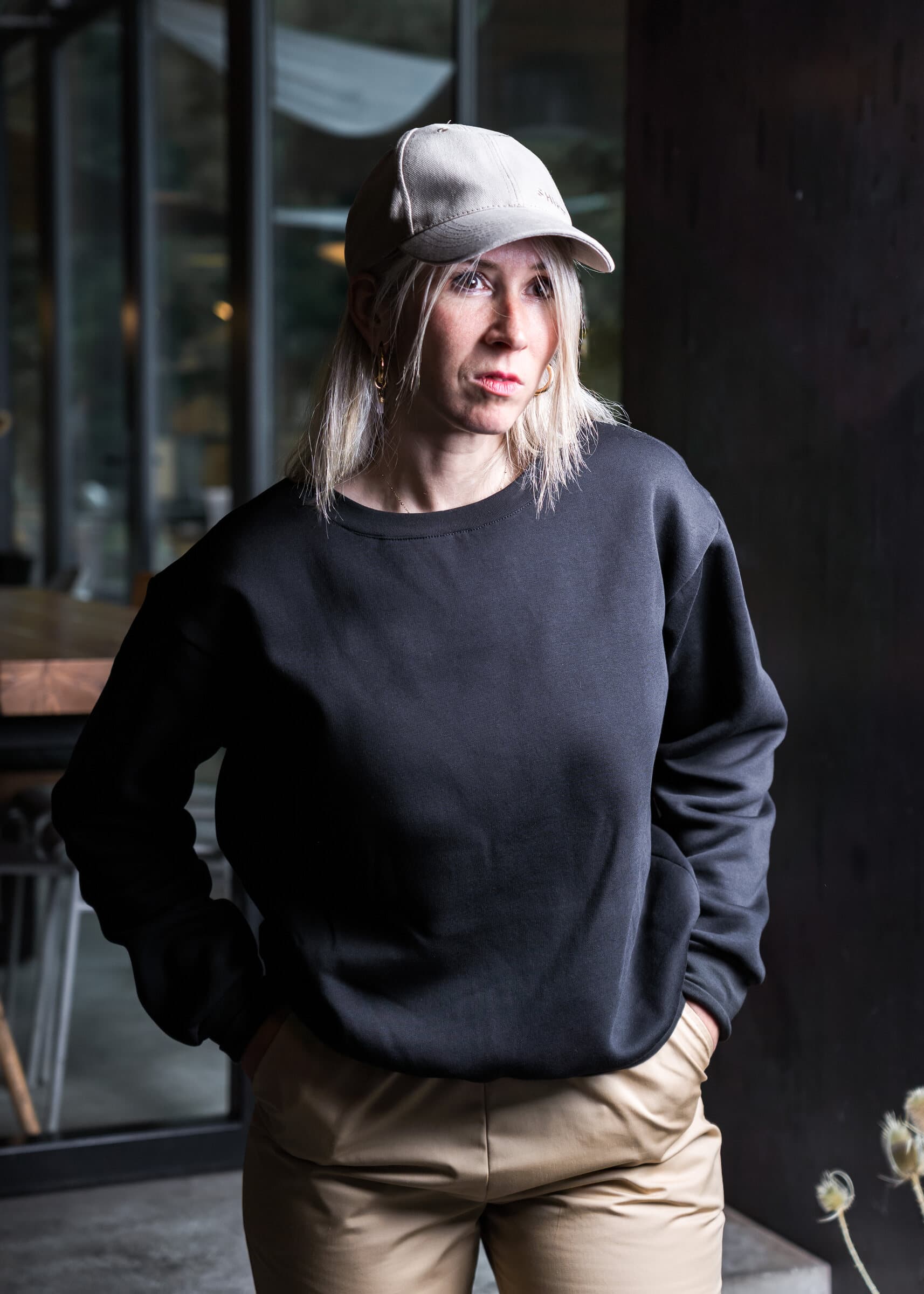 Black sweatshirt and sand trousers