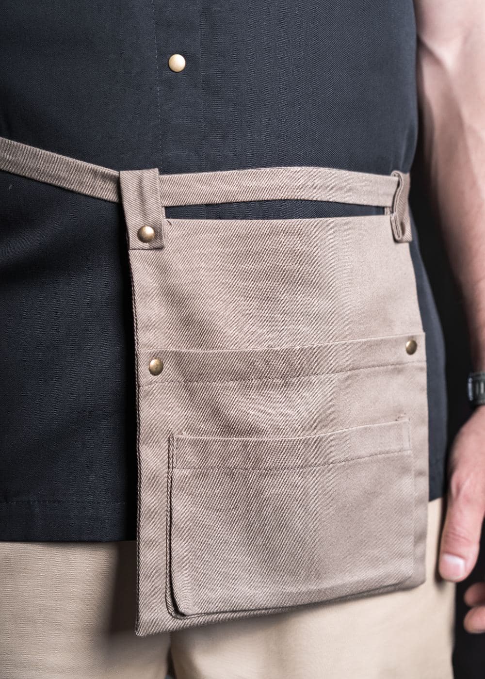 Detail of the pockets and loops on a sand pouch