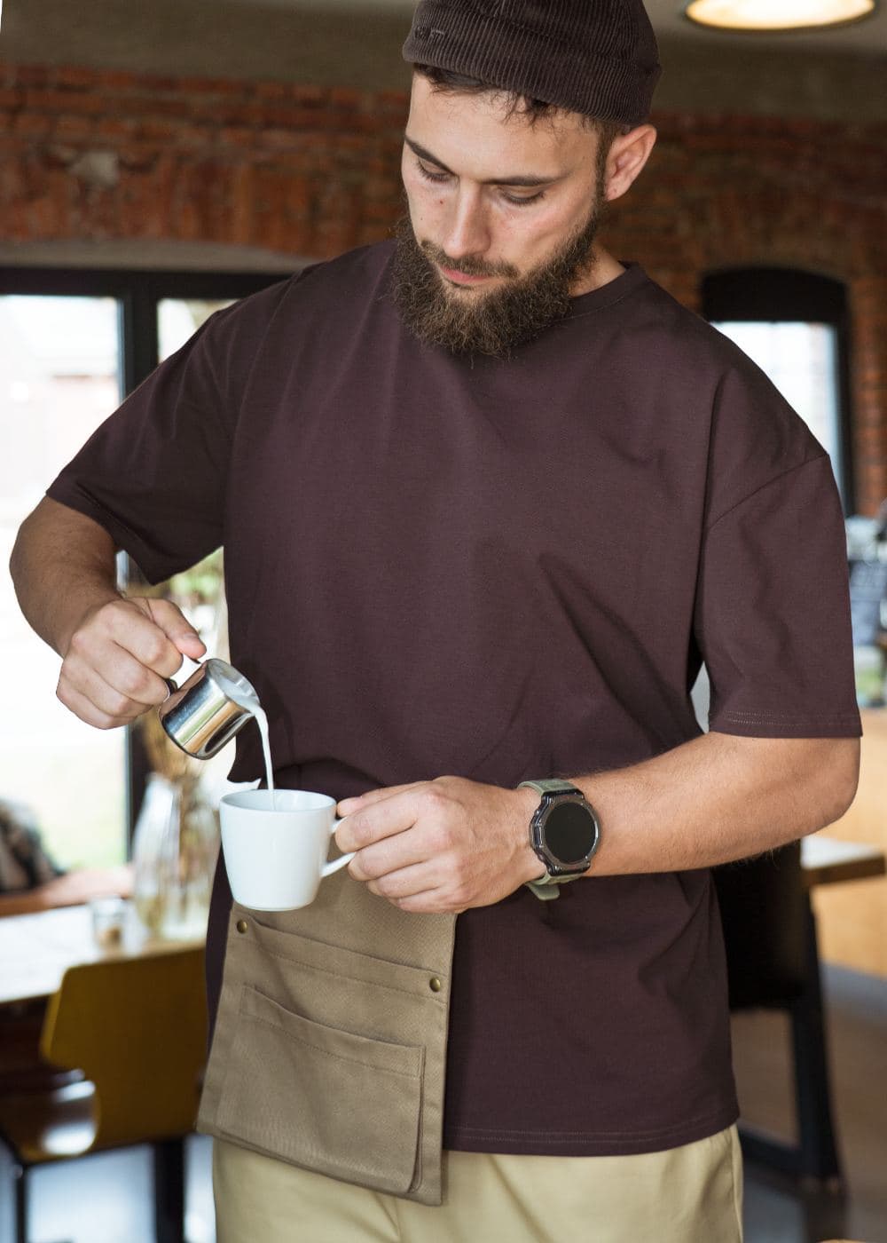 Burgundy oversized tee behind the bar